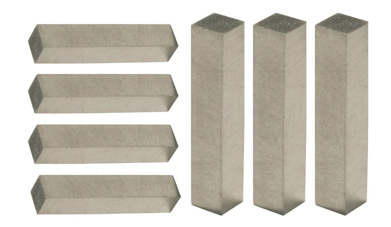 Several rectangular metal bars arranged in two groups on a white background