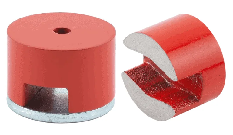 Two red cylindrical magnets, one intact and one cut to show a slotted interior.