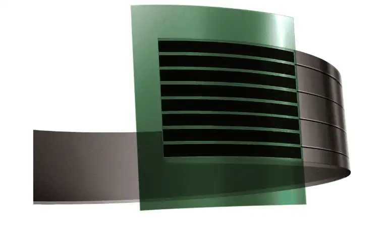 Coiled black magnetic tape stacked in layers.