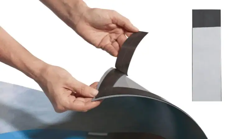 Two long strips of dark flexible material aligned side by side on a white background.