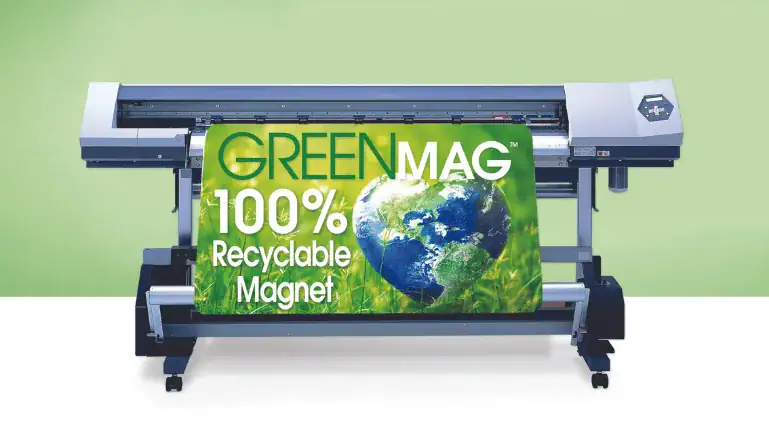 Glossy white sheet being fed into a printer with printed graphics visible.