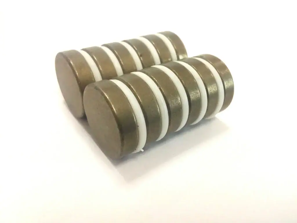 Two stacks of round brown discs with white spacers.